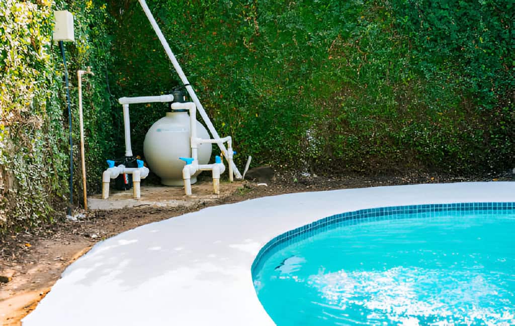 pool pump with sand filter-installed near of swimming pool