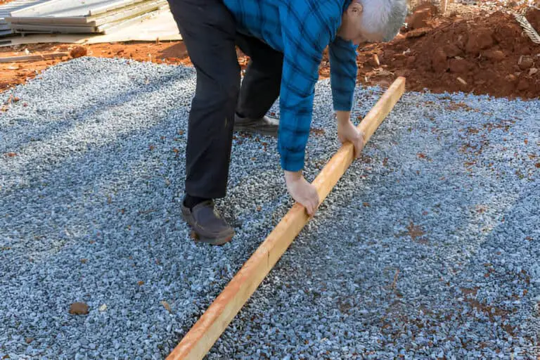 wood lumber needed to be-leveled-on-the gravel for the foundation