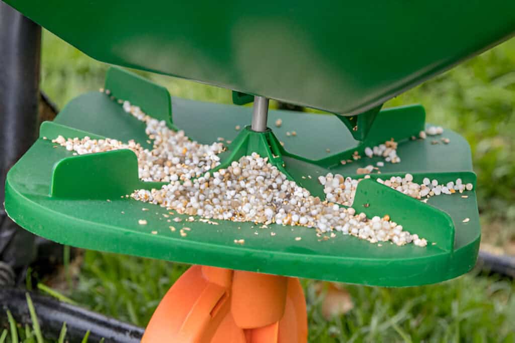 lawn fertilizer spreader with granule of weed killer herbicide urea
