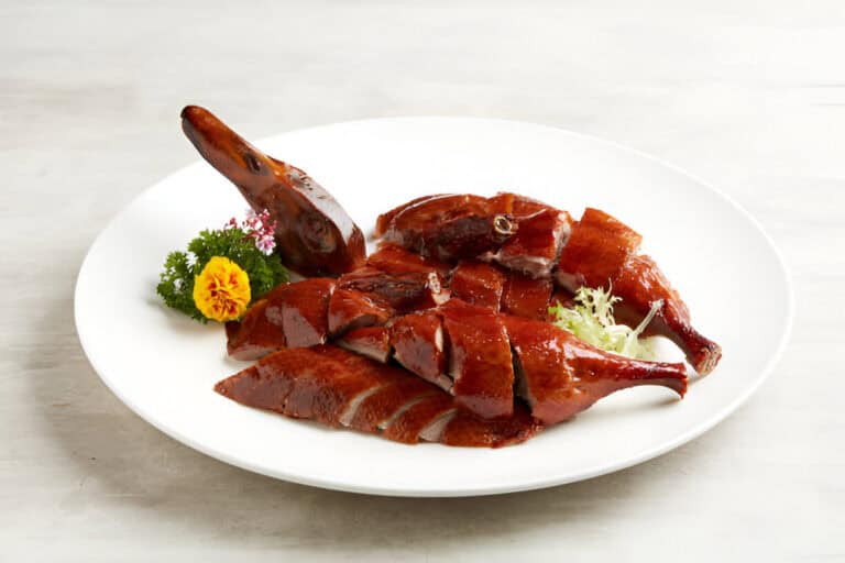 osmanthus infused crispy roasted duck served
